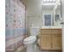 Compact bathroom featuring a toilet, vanity and shower with a nautical-themed curtain at 863 S Del Rancho --, Mesa, AZ 85208
