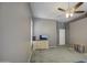 Bedroom features neutral walls, carpet, ceiling fan, and dresser at 863 S Del Rancho --, Mesa, AZ 85208