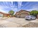 Inviting single-story home featuring a two-car garage, neutral stucco, and low maintenance desert landscaping at 863 S Del Rancho --, Mesa, AZ 85208