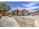 Charming single-story home featuring a two-car garage, neutral stucco, and low maintenance desert landscaping at 863 S Del Rancho --, Mesa, AZ 85208