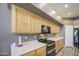 View of kitchen with cabinets, black appliances, and white counter tops at 863 S Del Rancho --, Mesa, AZ 85208