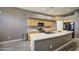 Kitchen with island, cabinets, black appliances, and view of refrigerator at 863 S Del Rancho --, Mesa, AZ 85208