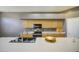 Kitchen view shows sink, island, cabinets, and black appliances at 863 S Del Rancho --, Mesa, AZ 85208