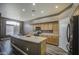 Kitchen featuring an island, cabinets, and black appliances at 863 S Del Rancho --, Mesa, AZ 85208