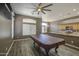 Open-concept living space with wood floors, ceiling fan, and view to kitchen at 863 S Del Rancho --, Mesa, AZ 85208