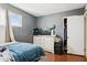 Bedroom with a TV and dresser with a window for natural light at 8724 N 28Th Ave, Phoenix, AZ 85051