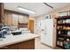 Kitchen featuring wood cabinets, white countertops, and white refrigerator at 8724 N 28Th Ave, Phoenix, AZ 85051