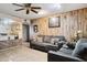 Cozy living room with ceiling fan, tile floors, wood paneling and comfortable sofas at 8724 N 28Th Ave, Phoenix, AZ 85051