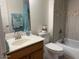 Cozy bathroom featuring tile accents, a vanity with a sink, and a toilet at 914 W Morelos St, Chandler, AZ 85225