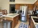 Well-maintained kitchen features stainless appliances and wood cabinets at 914 W Morelos St, Chandler, AZ 85225