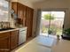 Kitchen featuring stainless steel appliances, wood cabinets, and a view of the backyard at 914 W Morelos St, Chandler, AZ 85225