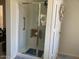 Accessible shower with grab bar and built-in seat features glass doors at 914 W Morelos St, Chandler, AZ 85225