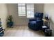 Bright sitting area with comfortable blue recliner and window with shutters at 914 W Morelos St, Chandler, AZ 85225