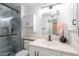 This remodeled bathroom features modern fixtures, a glass shower, and stylish vanity at 10644 W Campana Dr, Sun City, AZ 85351