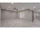 Spacious bonus room featuring recessed lighting, large windows, and light wood-look floors at 10644 W Campana Dr, Sun City, AZ 85351