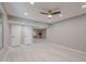 Large, naturally lit bonus room with ceiling fan and light wood-look floors at 10644 W Campana Dr, Sun City, AZ 85351