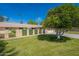 Charming single-story home with a well-maintained lawn and mature shade tree at 10644 W Campana Dr, Sun City, AZ 85351