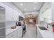 Bright kitchen with stainless steel appliances, quartz countertops, and recessed lighting at 10644 W Campana Dr, Sun City, AZ 85351