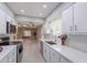 Updated kitchen with stainless steel appliances and a view to living room at 10644 W Campana Dr, Sun City, AZ 85351