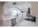 Updated kitchen with stainless steel appliances and quartz countertops at 10644 W Campana Dr, Sun City, AZ 85351