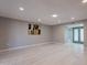 Spacious living room features recessed lighting, wood floors, and neutral paint at 10644 W Campana Dr, Sun City, AZ 85351
