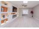 Living room featuring custom built-ins, recessed lighting, and skylight at 10644 W Campana Dr, Sun City, AZ 85351