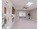 Bright living room featuring custom built-ins, a ceiling fan and recessed lighting at 10644 W Campana Dr, Sun City, AZ 85351