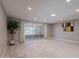 Spacious, bright room with sleek floors, and sliding glass doors to a private patio at 10644 W Campana Dr, Sun City, AZ 85351