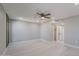 Spacious main bedroom featuring a ceiling fan and neutral paint, providing a calming retreat at 10644 W Campana Dr, Sun City, AZ 85351