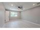 This bright main bedroom features neutral walls, wood-look floors, and a ceiling fan at 10644 W Campana Dr, Sun City, AZ 85351