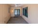 Cozy sun room with tile flooring, ample natural light, and views of the front yard at 10644 W Campana Dr, Sun City, AZ 85351