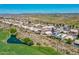 Community home with solar panels, lush golf course views, and neighborhood pond at 11547 W King Snake Ct, Surprise, AZ 85378