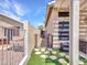 Back yard featuring a well-maintained fence, desert landscaping, and artificial grass at 11547 W King Snake Ct, Surprise, AZ 85378