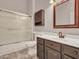 Bathroom featuring a shower/tub combo, vanity with a mirror, a toilet, and a cabinet at 11547 W King Snake Ct, Surprise, AZ 85378