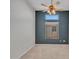 Neutral bedroom showcasing a fan, large window with blinds, and plush carpet flooring at 11547 W King Snake Ct, Surprise, AZ 85378