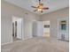 Open layout bedroom with carpet flooring and doors to other rooms at 11547 W King Snake Ct, Surprise, AZ 85378