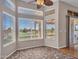 This eat-in dining area has large windows with neighborhood views at 11547 W King Snake Ct, Surprise, AZ 85378