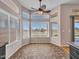 Sunlit dining area with large windows offering scenic views and tile floors at 11547 W King Snake Ct, Surprise, AZ 85378