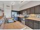 Beautiful kitchen with stainless steel appliances and wood cabinets, perfect for cooking at 11547 W King Snake Ct, Surprise, AZ 85378
