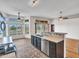 Eat-in kitchen with stainless steel appliances, view of backyard, and open layout at 11547 W King Snake Ct, Surprise, AZ 85378