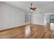 Open living room featuring hardwood floors and large windows, perfect for entertaining at 11547 W King Snake Ct, Surprise, AZ 85378