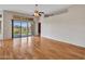 Bright living room with hardwood floors and sliding glass doors that lead to the backyard at 11547 W King Snake Ct, Surprise, AZ 85378
