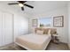 Bright bedroom featuring a ceiling fan, closet, and serene mountain views at 13020 N 18Th St, Phoenix, AZ 85022
