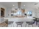 Modern kitchen boasts stainless steel appliances, a breakfast bar, and quartz countertops at 13020 N 18Th St, Phoenix, AZ 85022