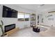 A cozy living room area featuring a decorative fireplace and bright window at 13020 N 18Th St, Phoenix, AZ 85022