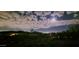 Expansive night view featuring a moonlit sky over the mountains and city lights below at 13020 N 18Th St, Phoenix, AZ 85022