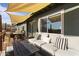 Inviting outdoor seating area with a shade sail, ideal for relaxing or entertaining at 13020 N 18Th St, Phoenix, AZ 85022