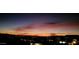 Beautiful sunset paints the sky with vibrant colors over a sprawling cityscape and distant mountains at 13020 N 18Th St, Phoenix, AZ 85022