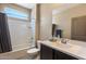 Well-lit bathroom with a shower-tub combination, and a vanity with a sink at 13612 W Desert Moon Way, Peoria, AZ 85383