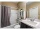 Clean bathroom with a shower-tub combination, white vanity, and a mirror, offering a functional space at 13612 W Desert Moon Way, Peoria, AZ 85383